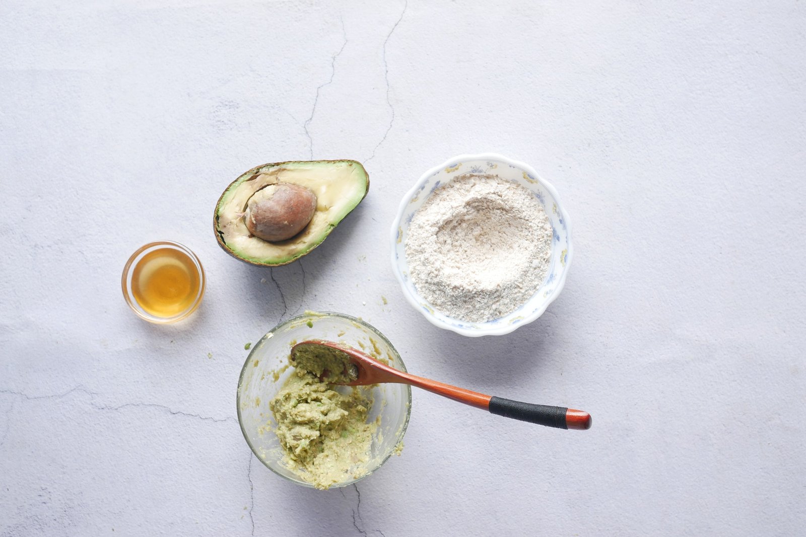 making homemade natural avocado cosmetic on table